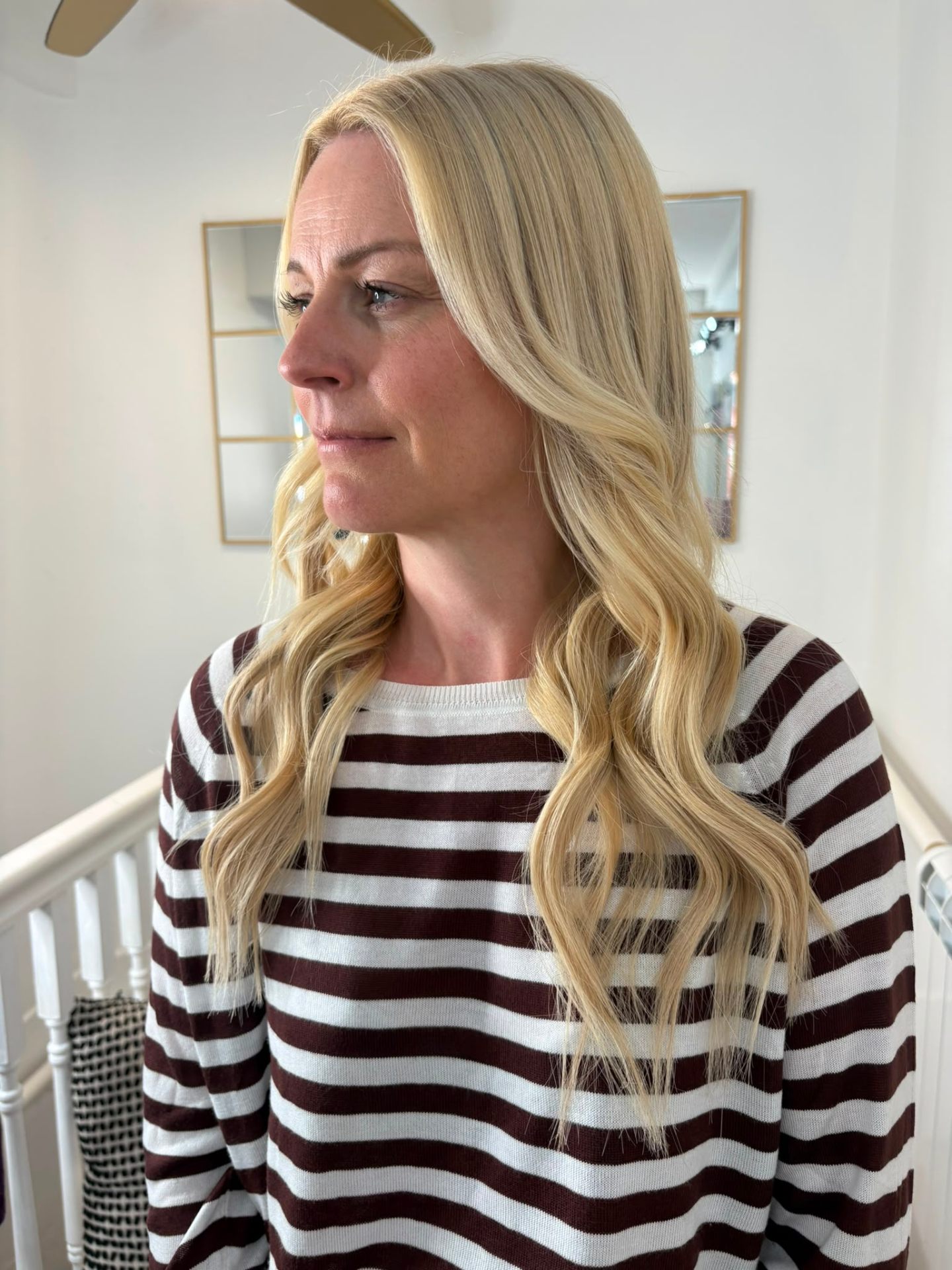 Warm blonde soft waves, side profile