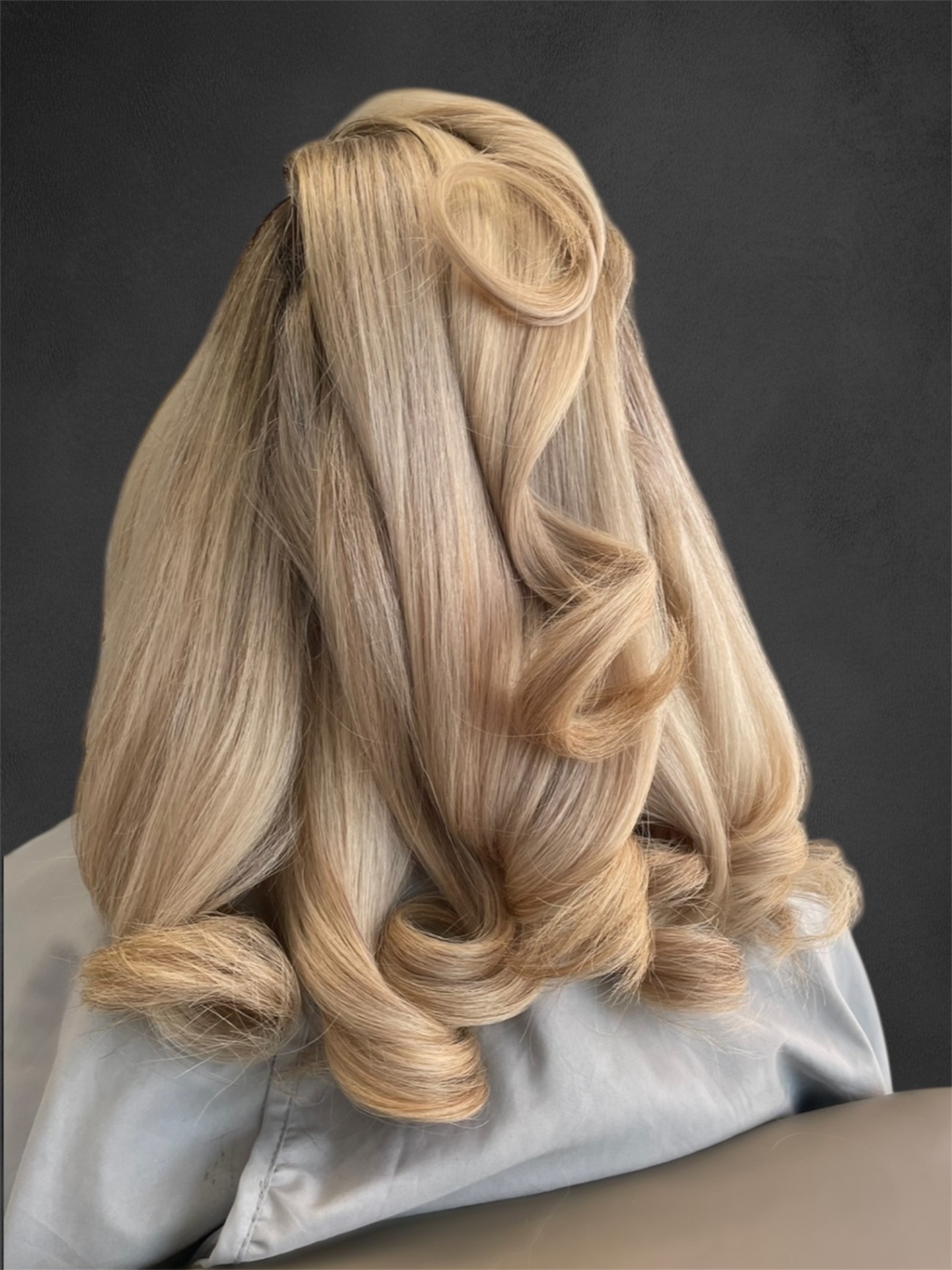 Woman with a voluminous glossy blow-dry at Malibu Hair UK Exeter
