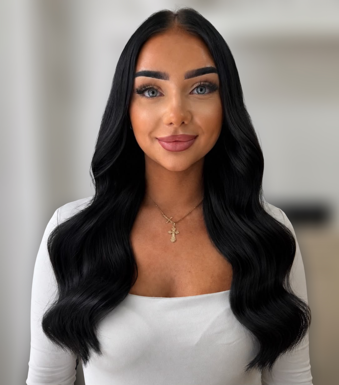 Glossy jet-black waves, half-parted